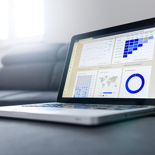 laptop with graphs and charts