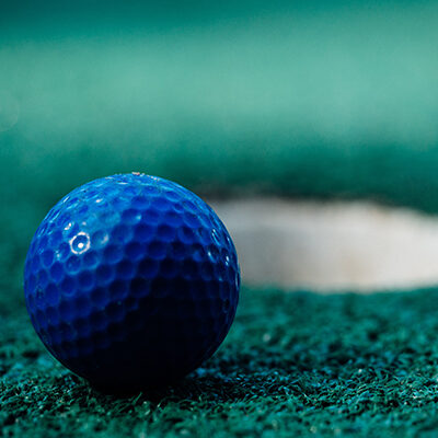 blue golf ball on green